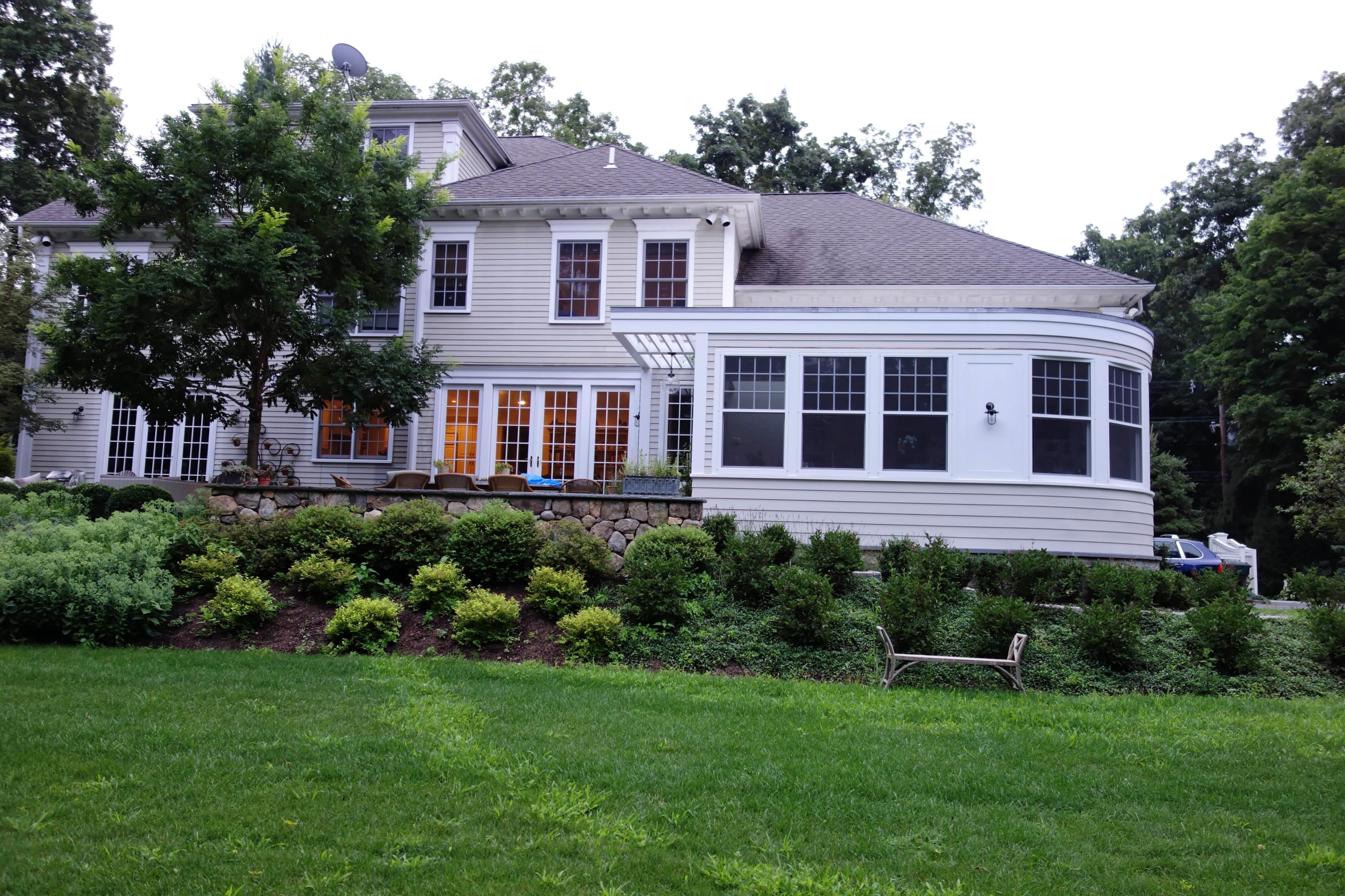 276 White Oak Shade Road New Canaan, CT 06840 - Photo 24 of 36 a house view with a garden space