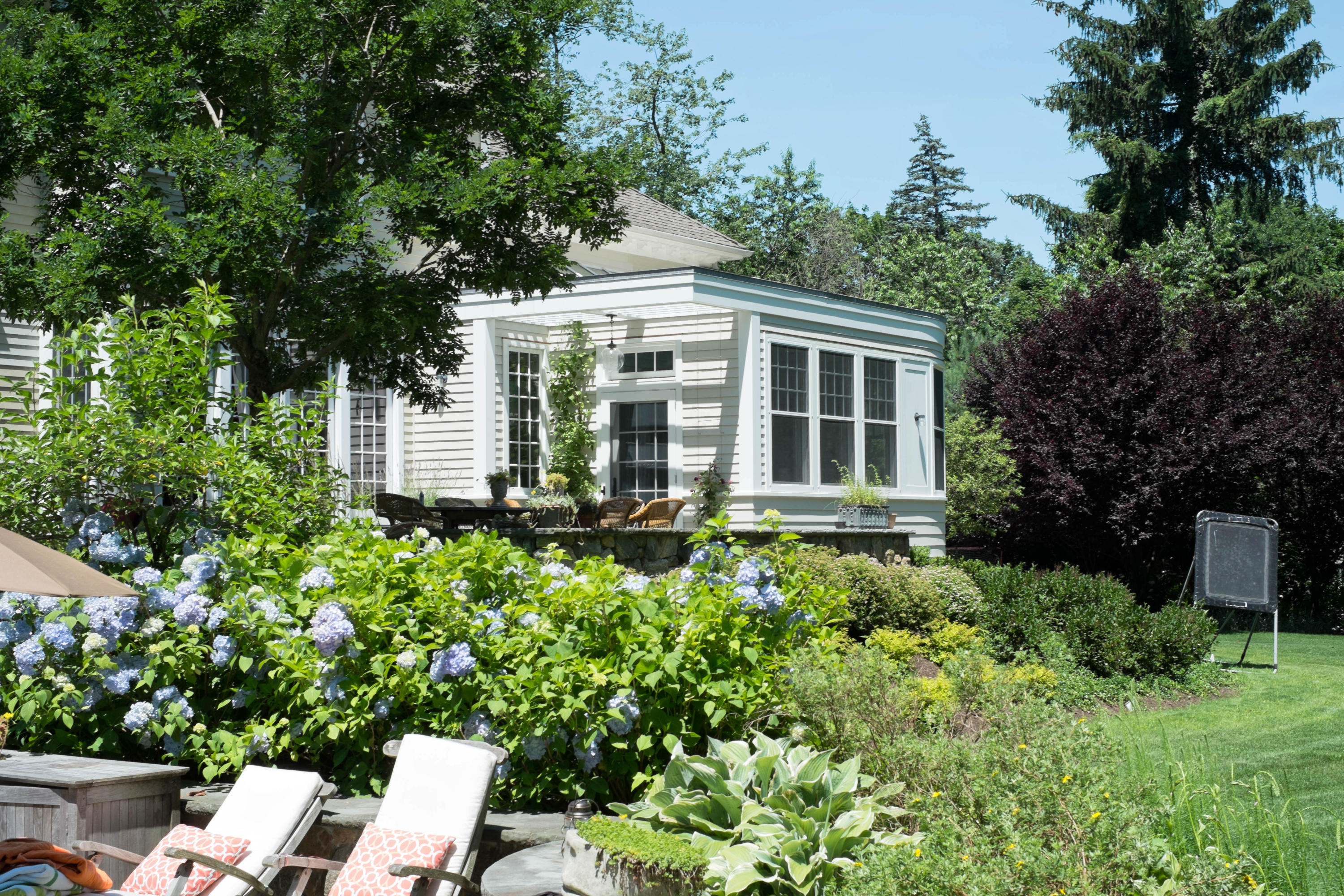 276 White Oak Shade Road New Canaan, CT 06840 - Photo 27 of 36 front view of a house with a yard