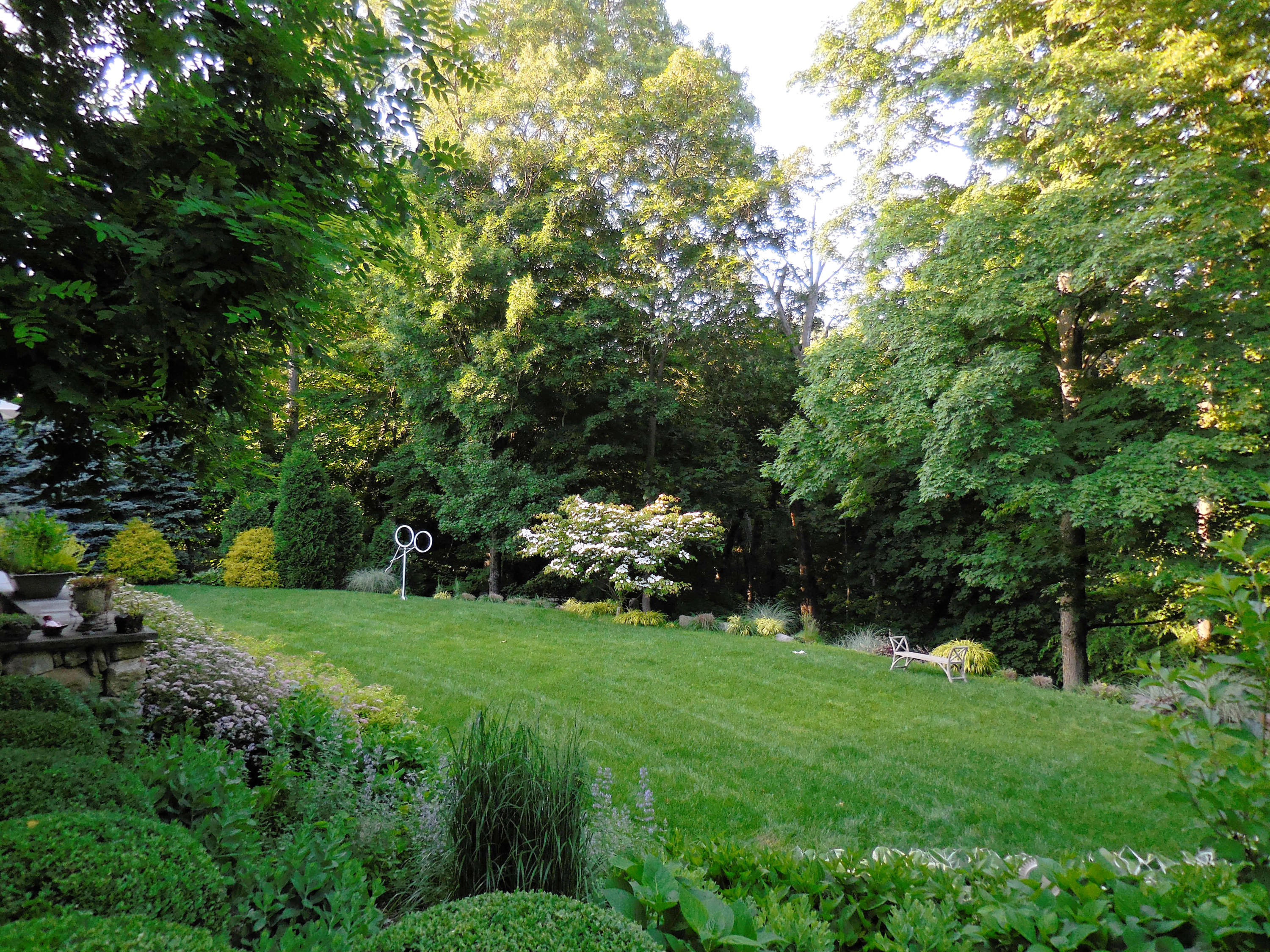 276 White Oak Shade Road New Canaan, CT 06840 - Photo 29 of 36 a view of a tree in a garden