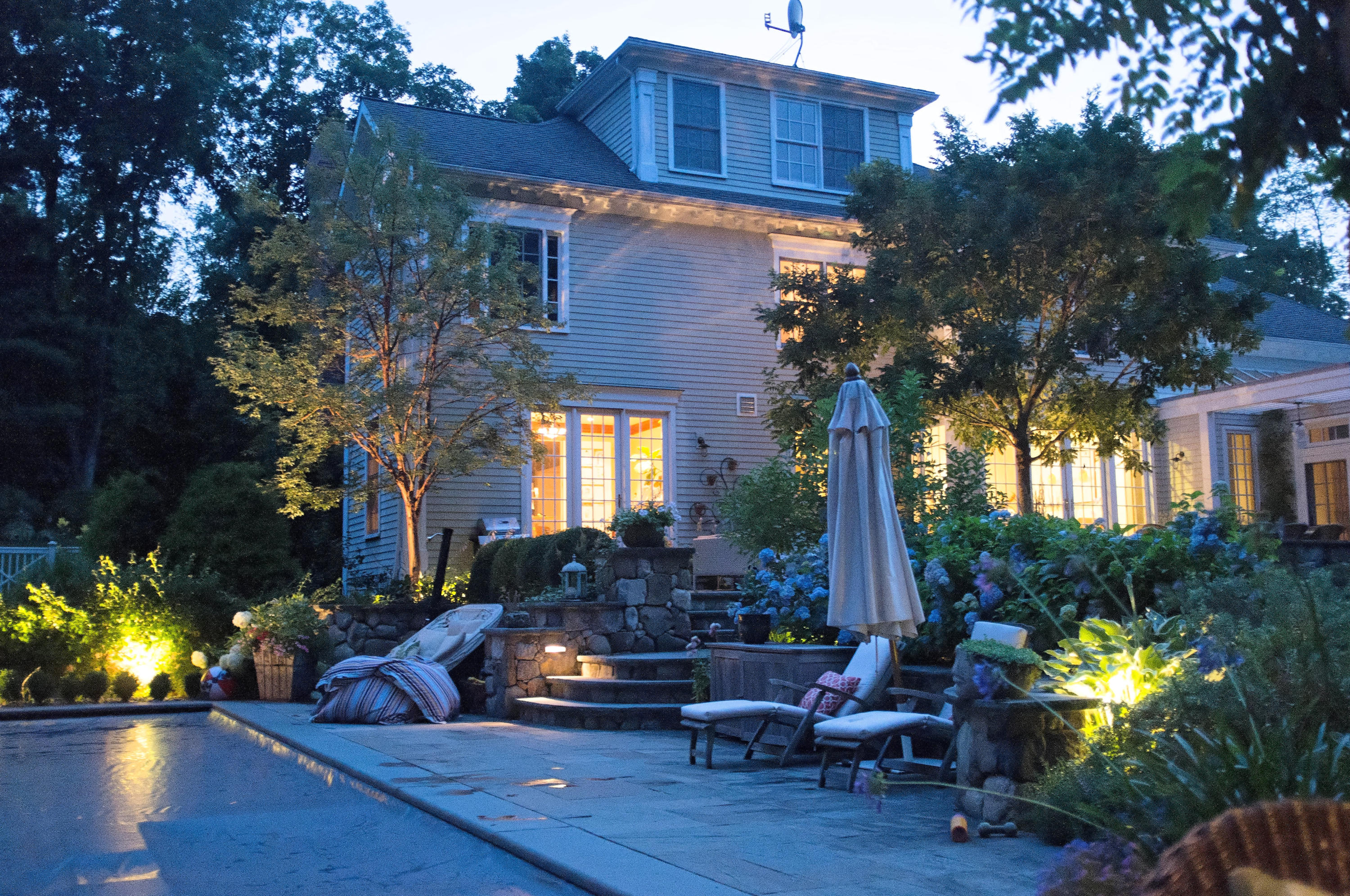276 White Oak Shade Road New Canaan, CT 06840 - Photo 34 of 36 a view of a house with a patio filled with furniture