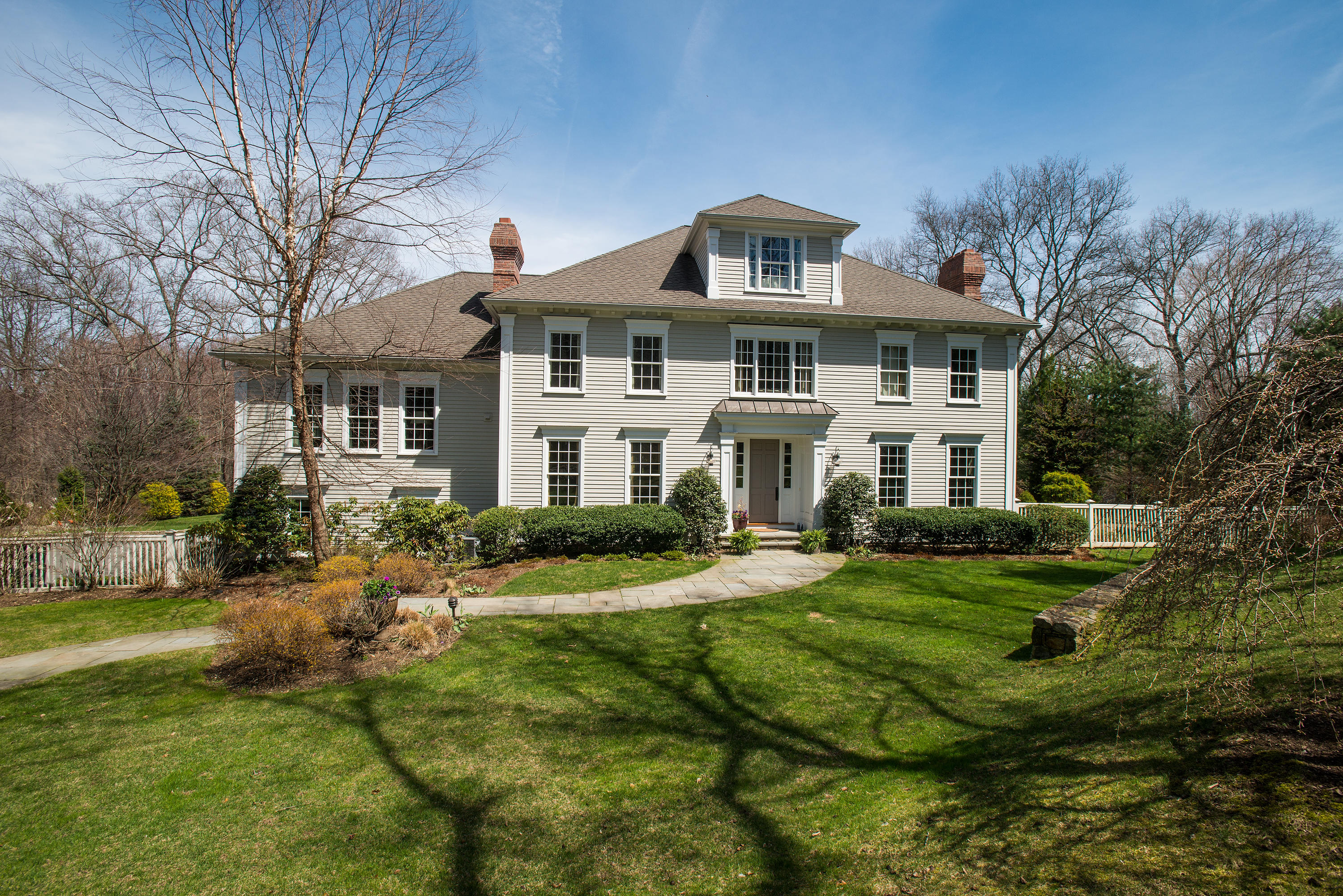 276 White Oak Shade Road New Canaan, CT 06840 - Photo 36 of 36 a front view of a house with a yard