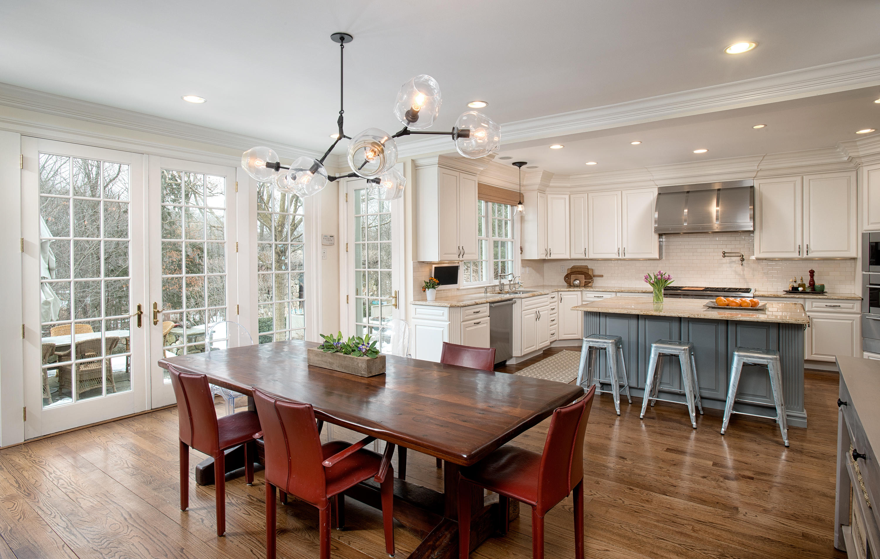 276 White Oak Shade Road New Canaan, CT 06840 - Photo 10 of 36 a dining room with stainless steel appliances granite countertop a dining table chairs and couches