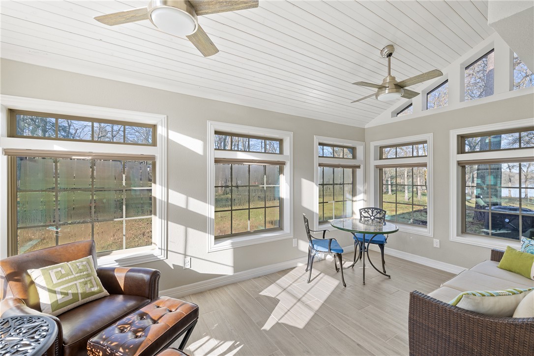 9249 Clyde Acord Road Franklin, TX 77856 - Photo 4 of 23 Sunroom featuring wood ceiling, ceiling fan, and vaulted ceiling