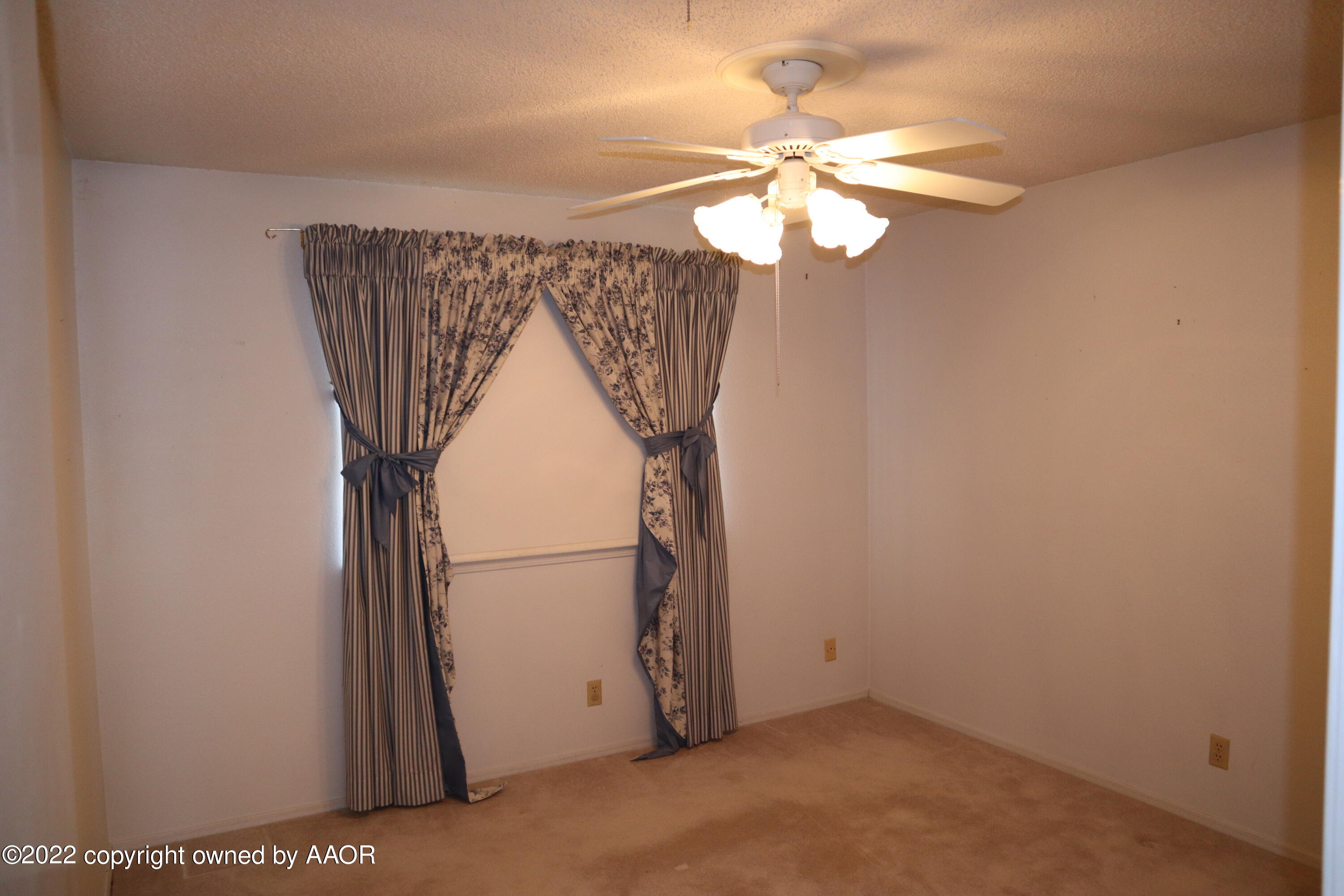 8201 Goodnight Trail Amarillo, TX 79110 - Photo 12 of 23 a view of a livingroom with a fan
