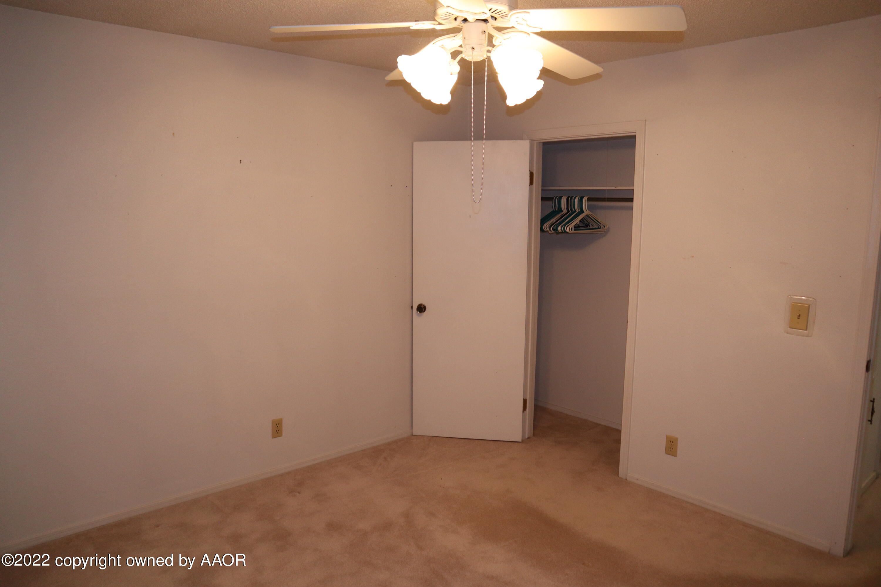 8201 Goodnight Trail Amarillo, TX 79110 - Photo 13 of 23 an empty room with a chandelier fan