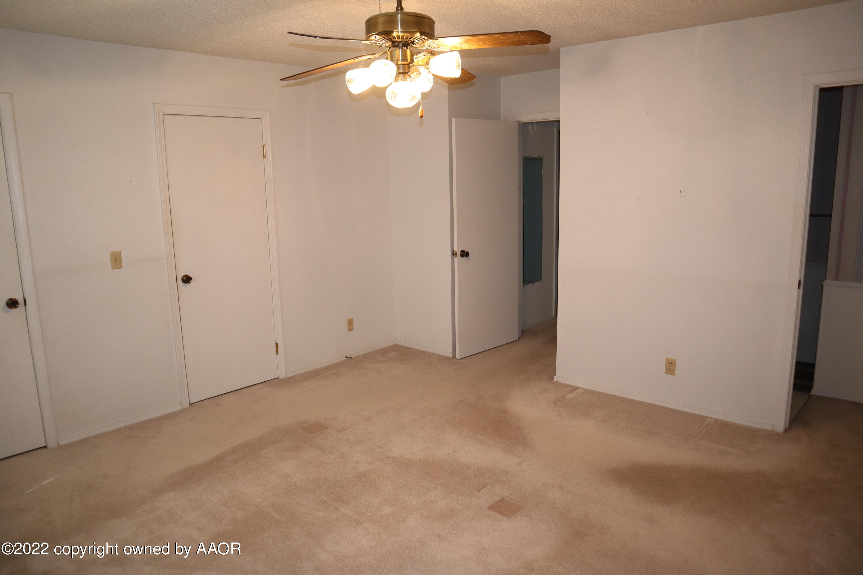 8201 Goodnight Trail Amarillo, TX 79110 - Photo 17 of 23 a view of an empty room with a fan