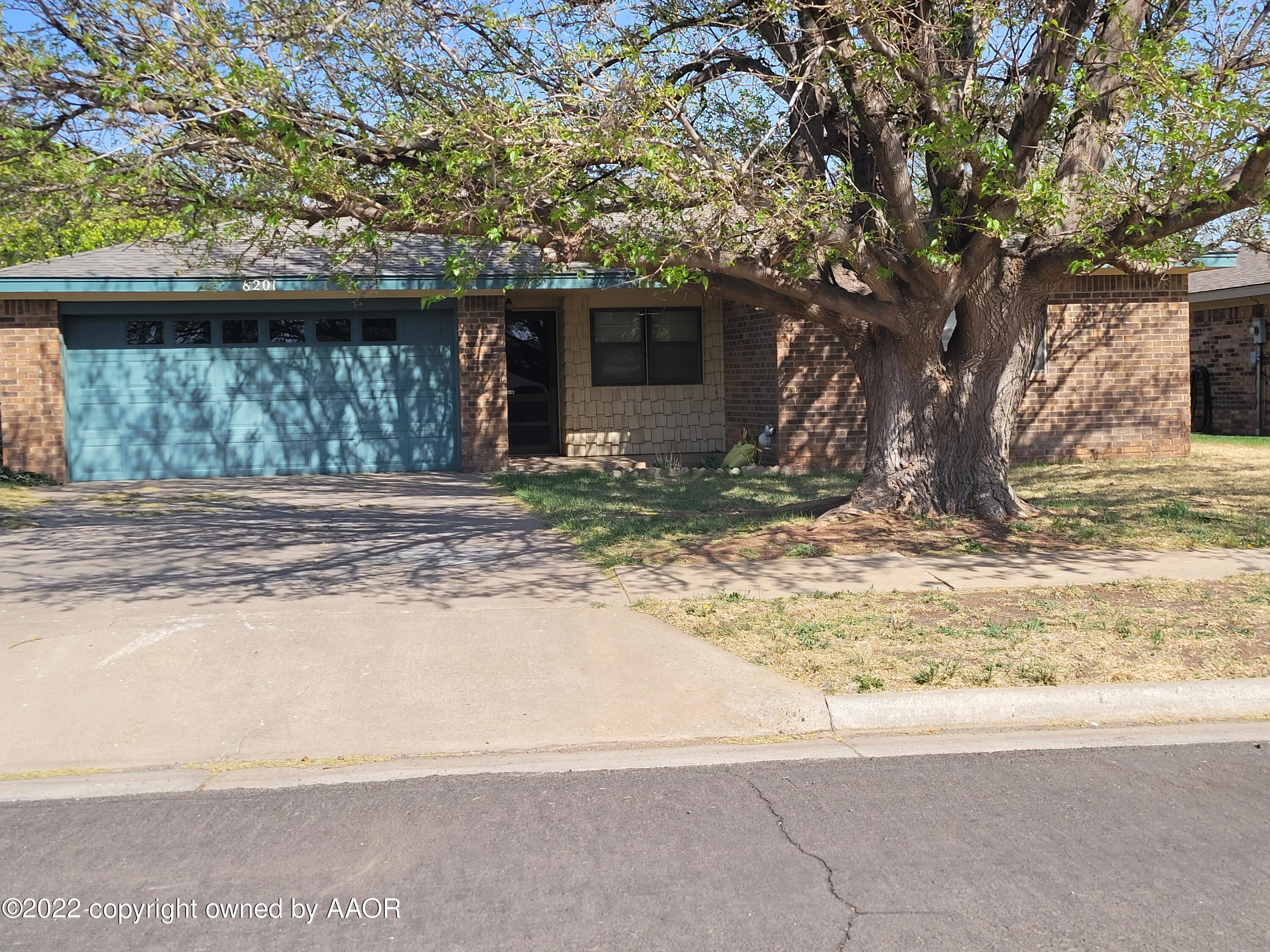 8201 Goodnight Trail Amarillo, TX 79110 - Photo 2 of 23 a house with trees in the background