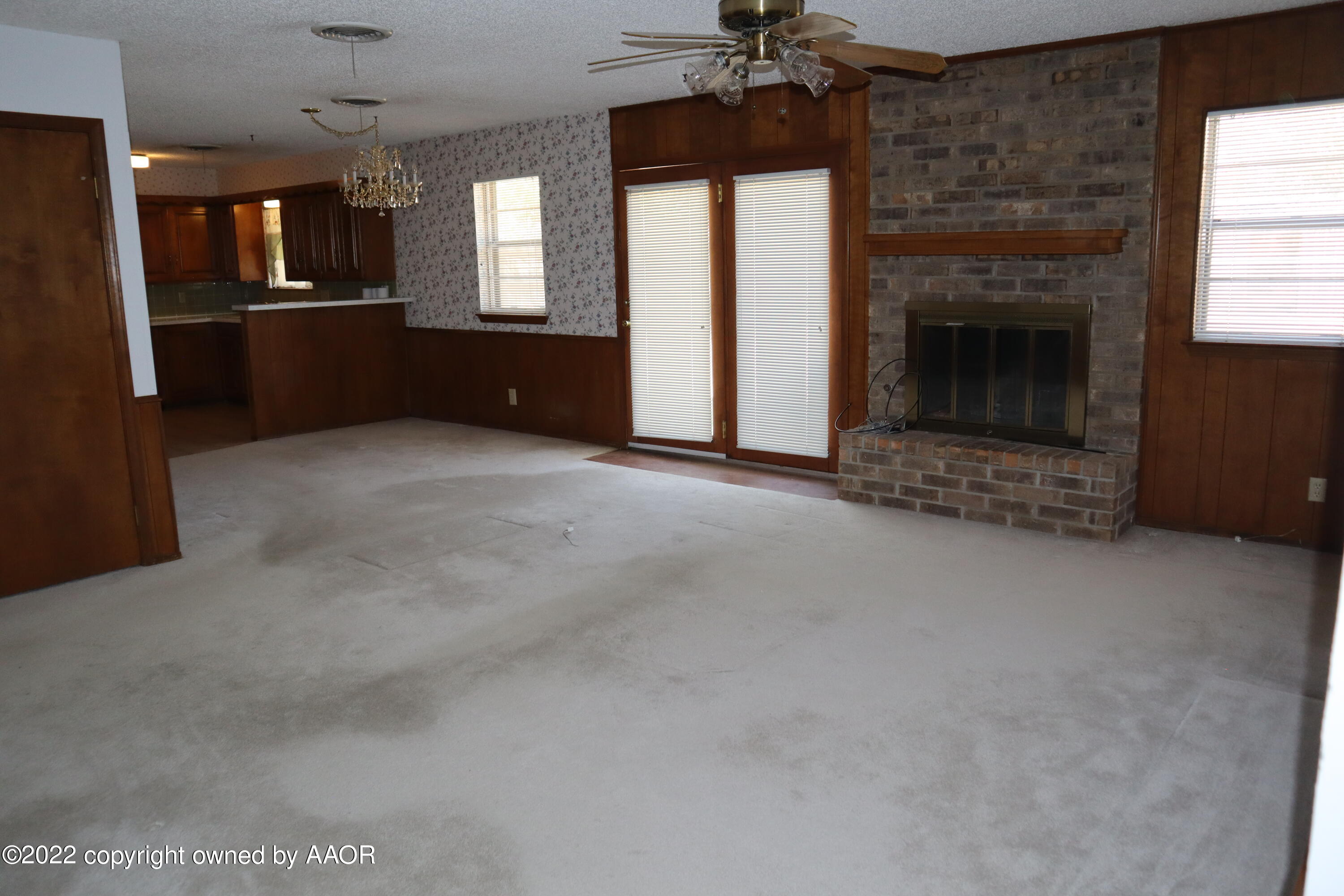 8201 Goodnight Trail Amarillo, TX 79110 - Photo 5 of 23 a open kitchen view with fireplace and window