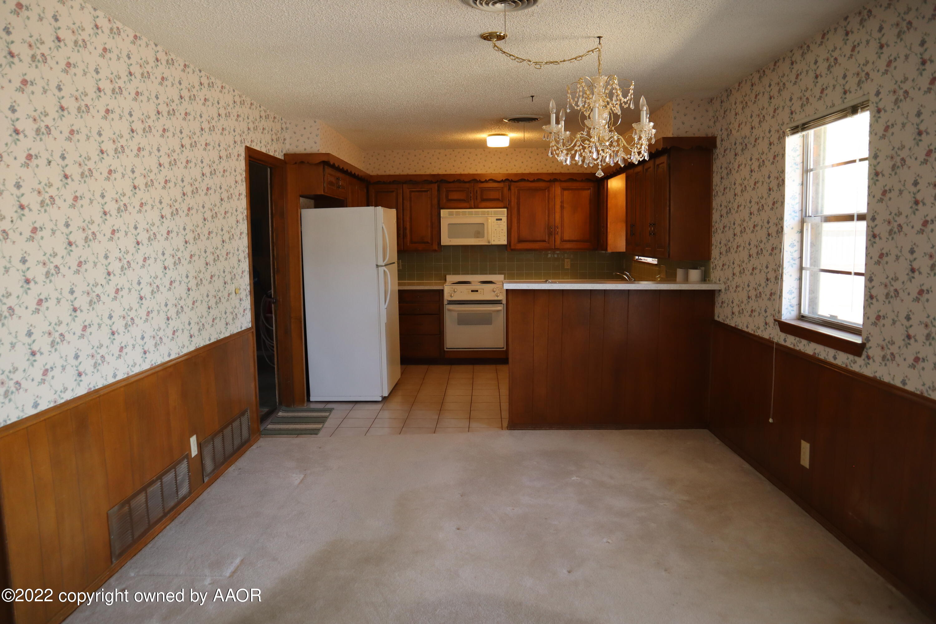 8201 Goodnight Trail Amarillo, TX 79110 - Photo 6 of 23 a open kitchen with a refrigerator a stove top oven a sink and dishwasher