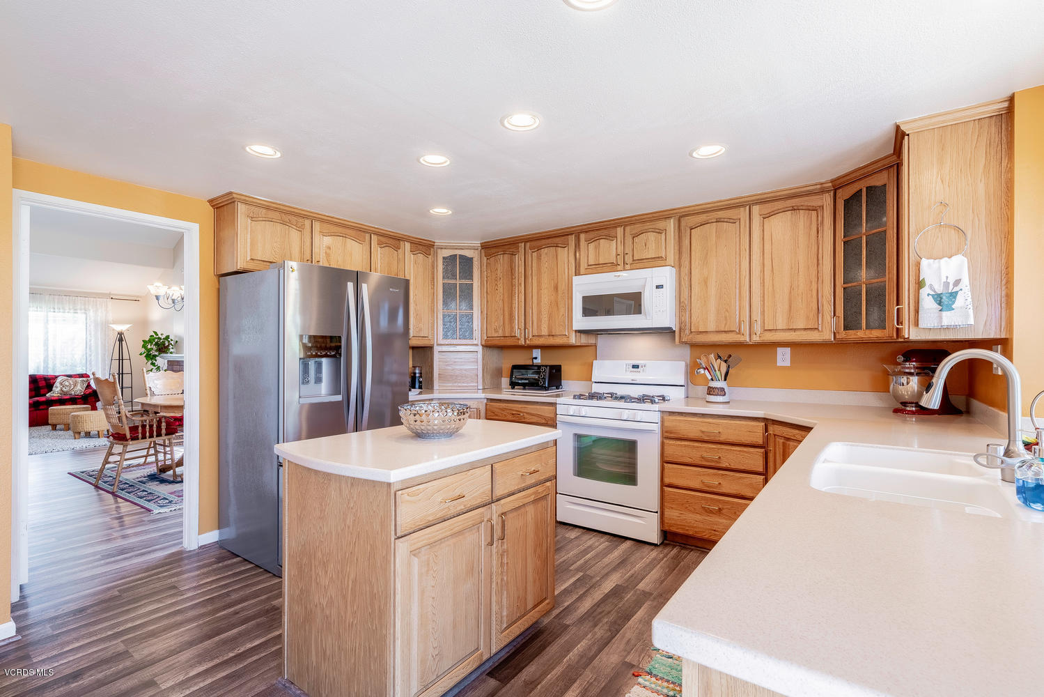 13762 Gunsmoke Road Moorpark, CA 93021 - Photo 12 of 36 a kitchen with a sink a counter top space stainless steel appliances and cabinets