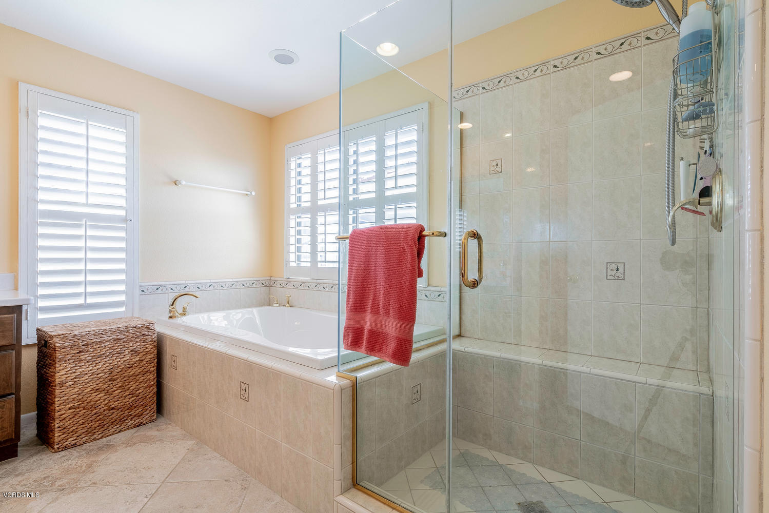 13762 Gunsmoke Road Moorpark, CA 93021 - Photo 23 of 36 a bathroom with a tub shower and sink