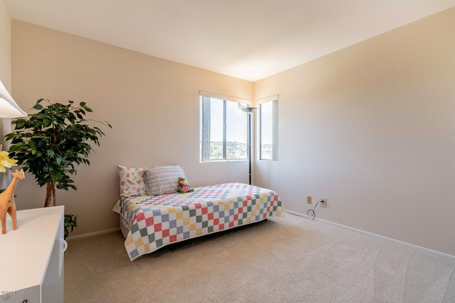 13762 Gunsmoke Road Moorpark, CA 93021 - Photo 29 of 36 a bedroom with a bed plant and a window