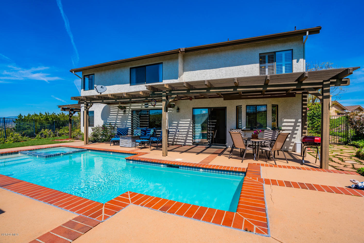 13762 Gunsmoke Road Moorpark, CA 93021 - Photo 33 of 36 a view of a house with swimming pool and sitting area