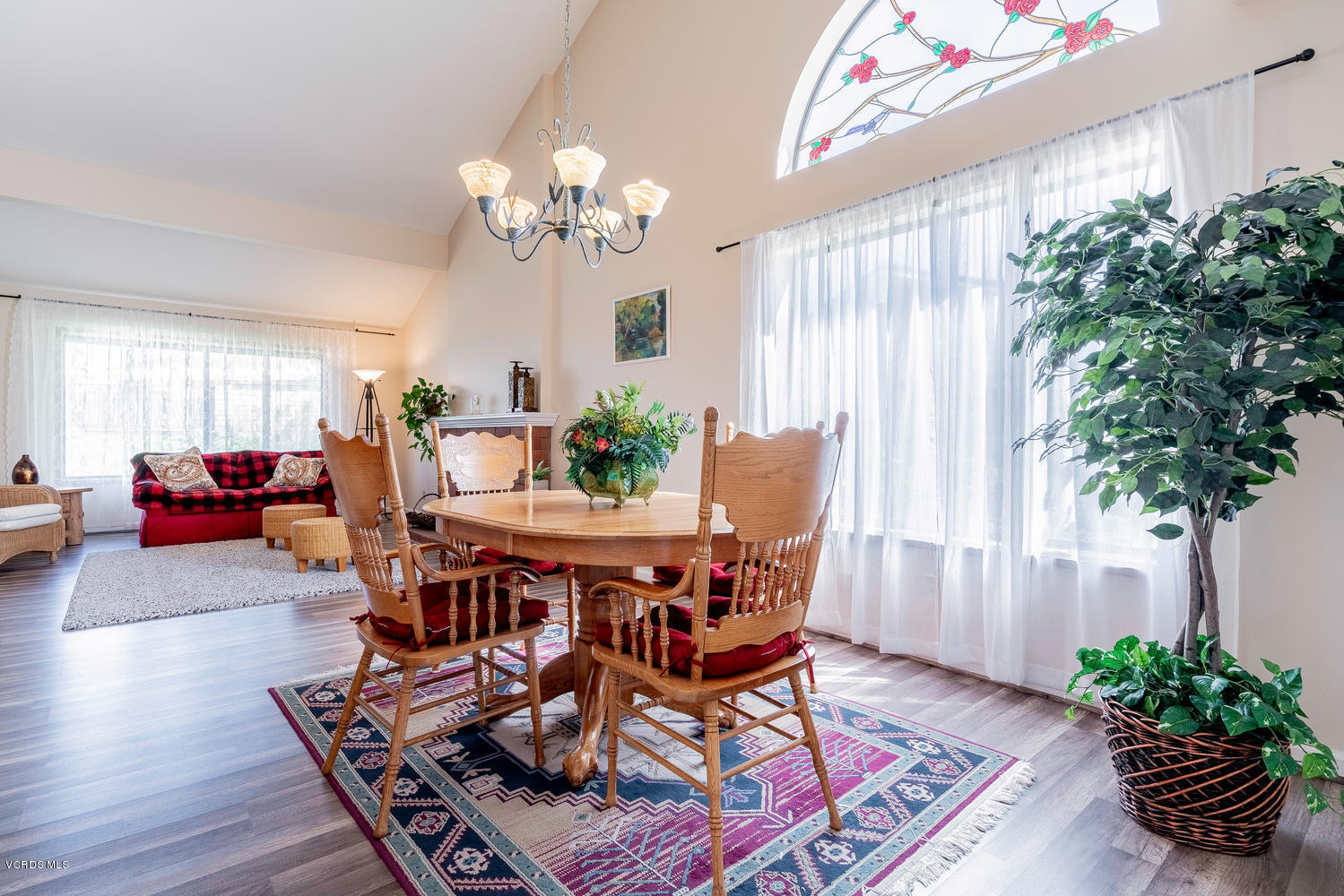 13762 Gunsmoke Road Moorpark, CA 93021 - Photo 10 of 36 a view of a dining room with furniture and a potted plant