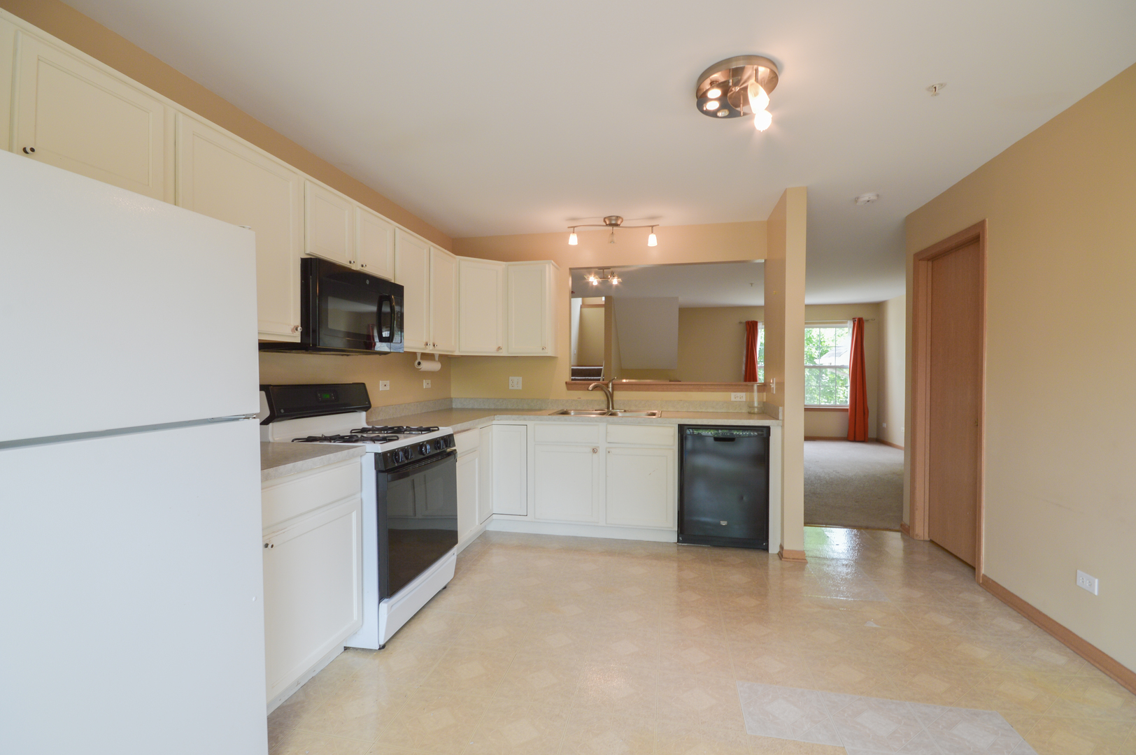 776 River Walk Drive Wheeling, IL 60090 - Photo 11 of 25 a kitchen with a white stove top oven and refrigerator