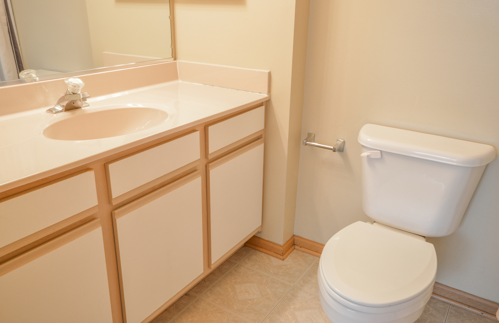 776 River Walk Drive Wheeling, IL 60090 - Photo 17 of 25 a white toilet sitting next to a bathroom sink