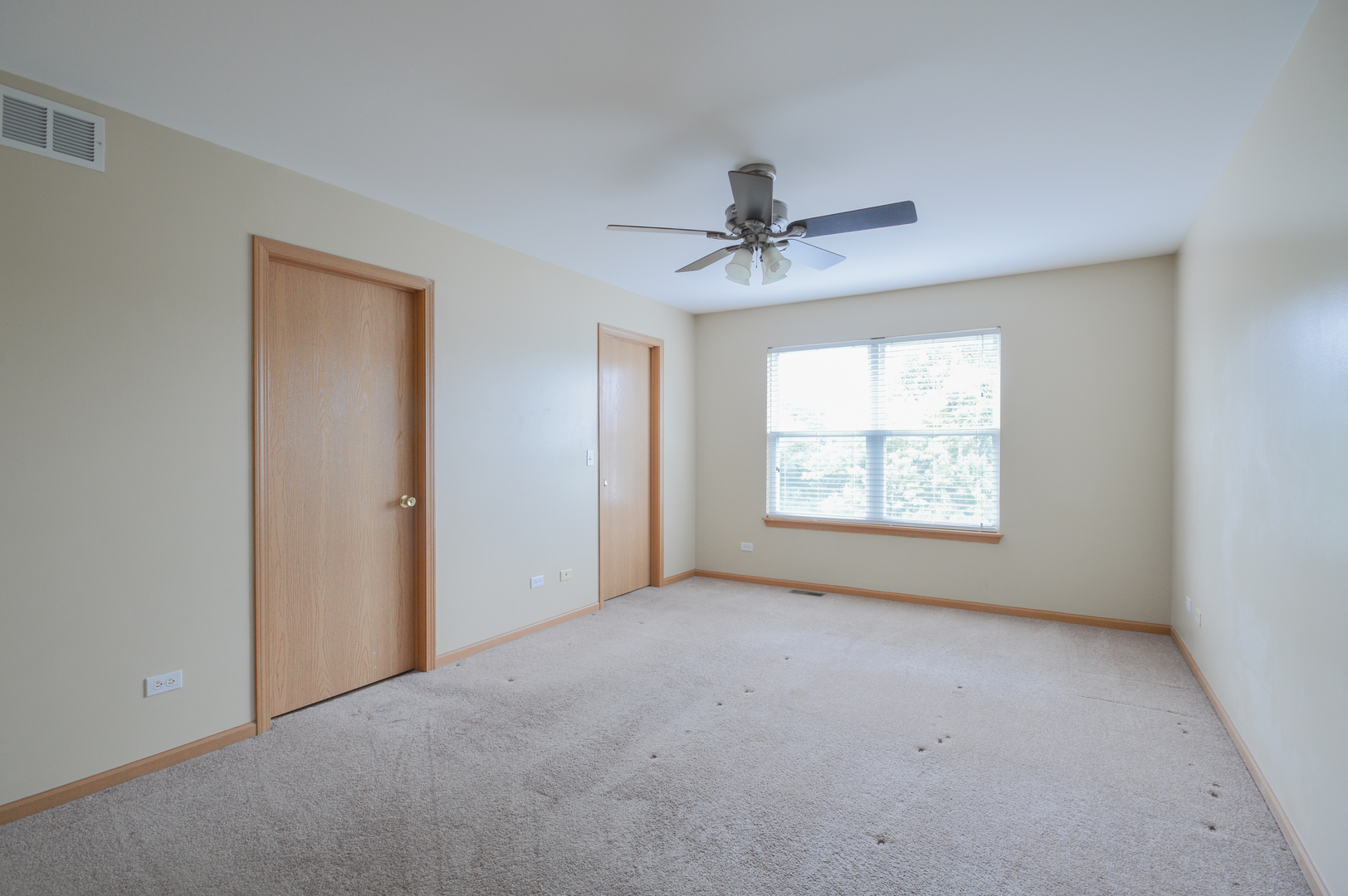 776 River Walk Drive Wheeling, IL 60090 - Photo 22 of 25 a view of a big room with windows and chandelier fan