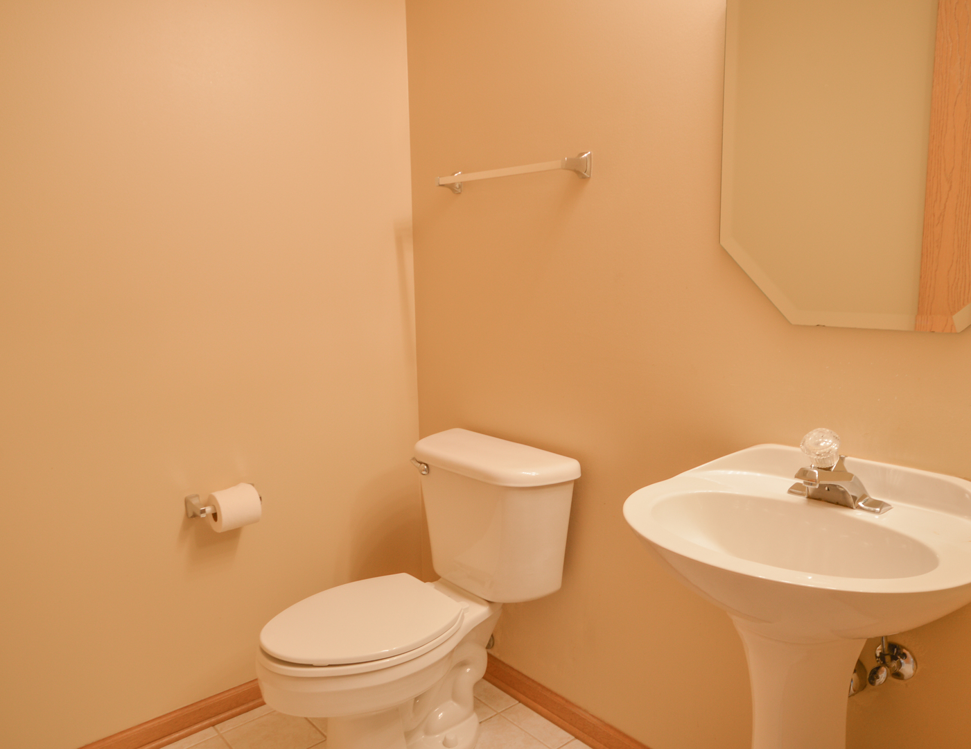 776 River Walk Drive Wheeling, IL 60090 - Photo 8 of 25 a bathroom with a toilet a sink and mirror