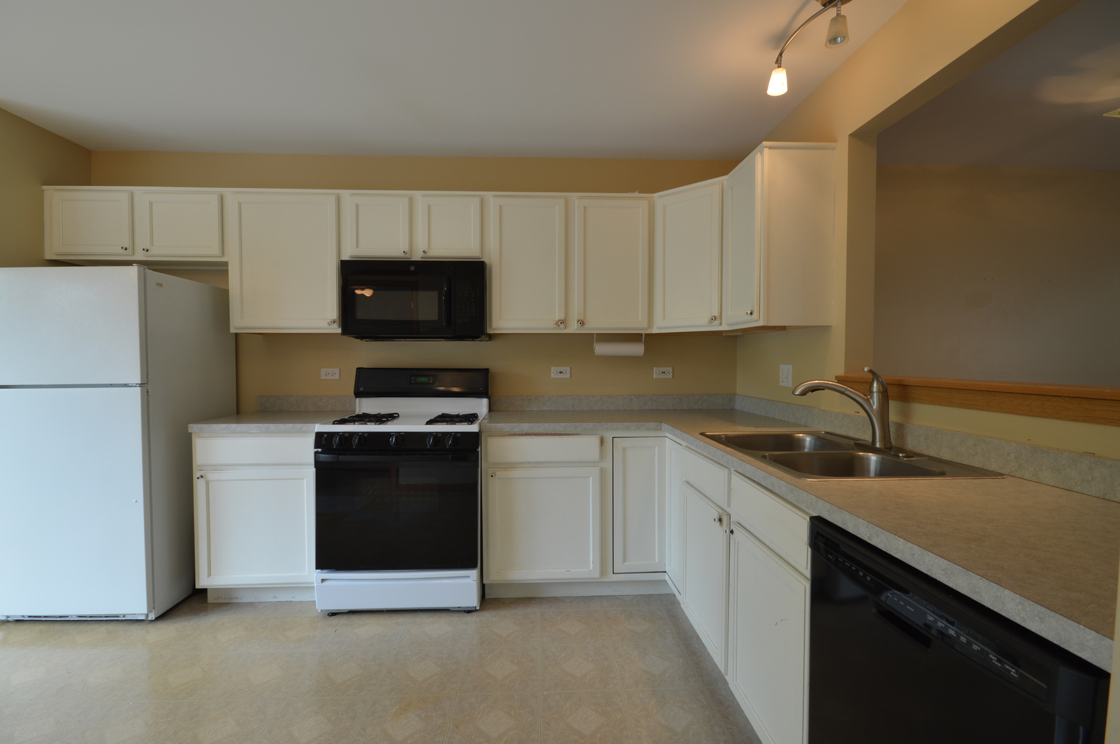 776 River Walk Drive Wheeling, IL 60090 - Photo 9 of 25 a kitchen with a sink and a stove top oven