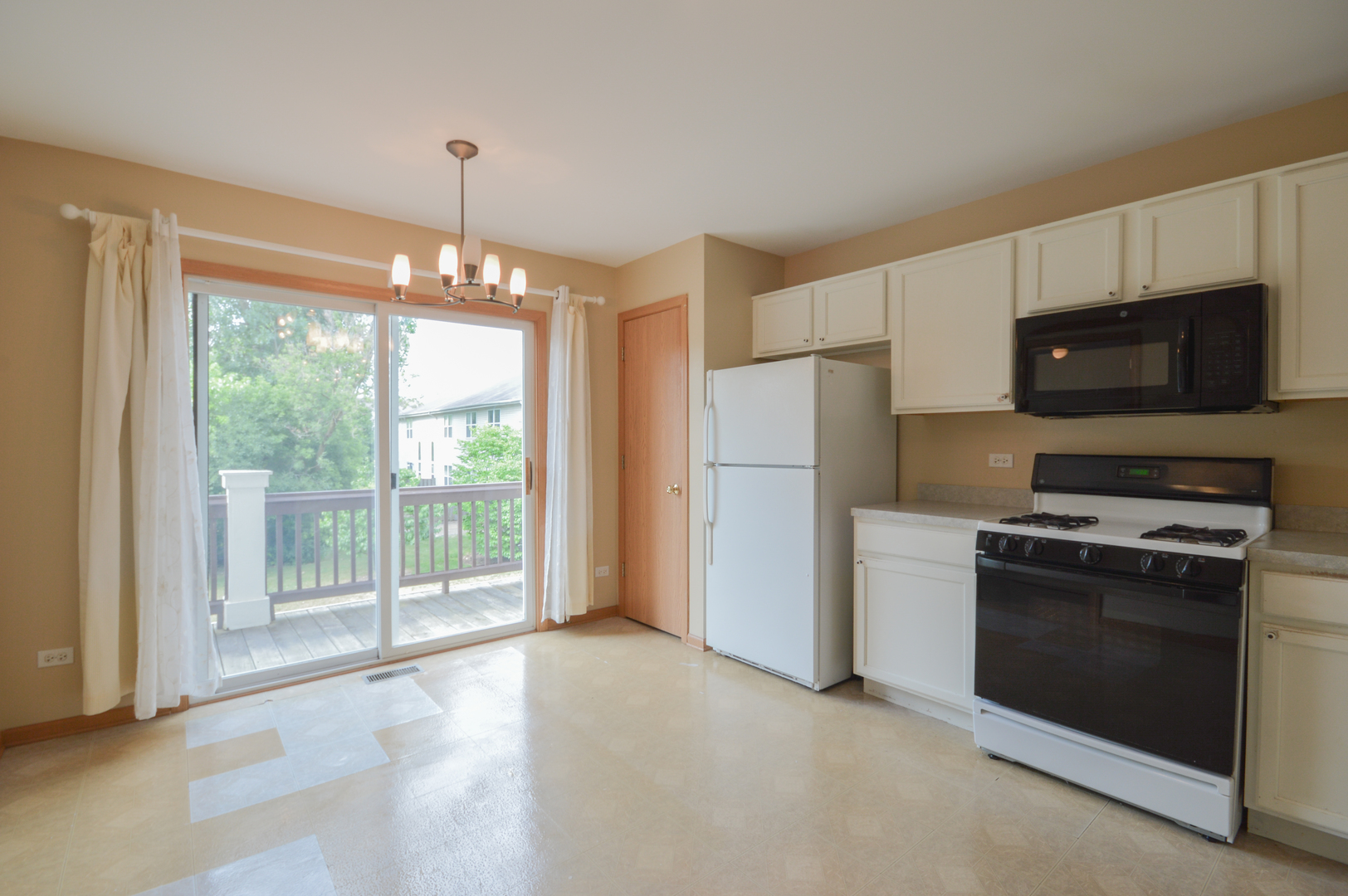 776 River Walk Drive Wheeling, IL 60090 - Photo 10 of 25 a kitchen with stainless steel appliances granite countertop a refrigerator oven a sink and dishwasher