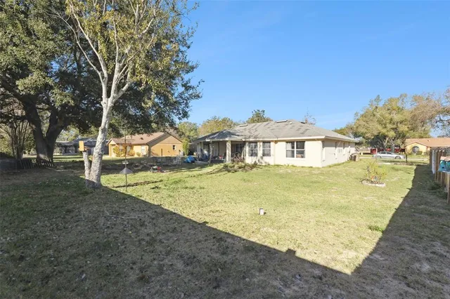 a view of an swimming pool with a yard