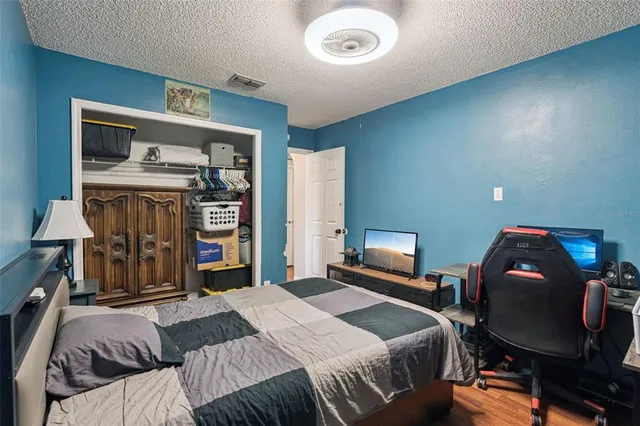 a bedroom with a bed and furniture