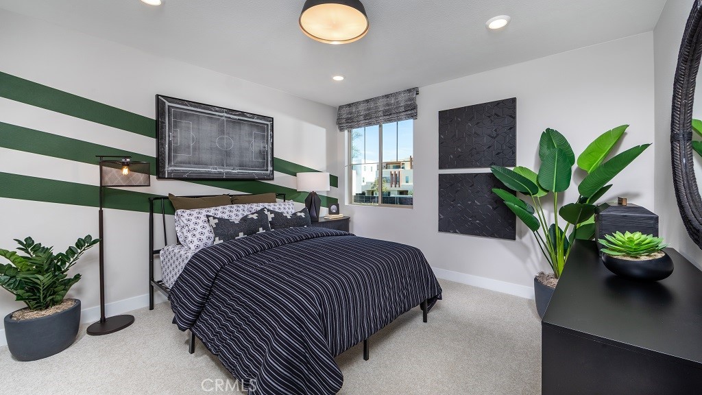 91 Interval Irvine, CA 92618 - Photo 10 of 14 a bedroom with a bed a potted plant and a window