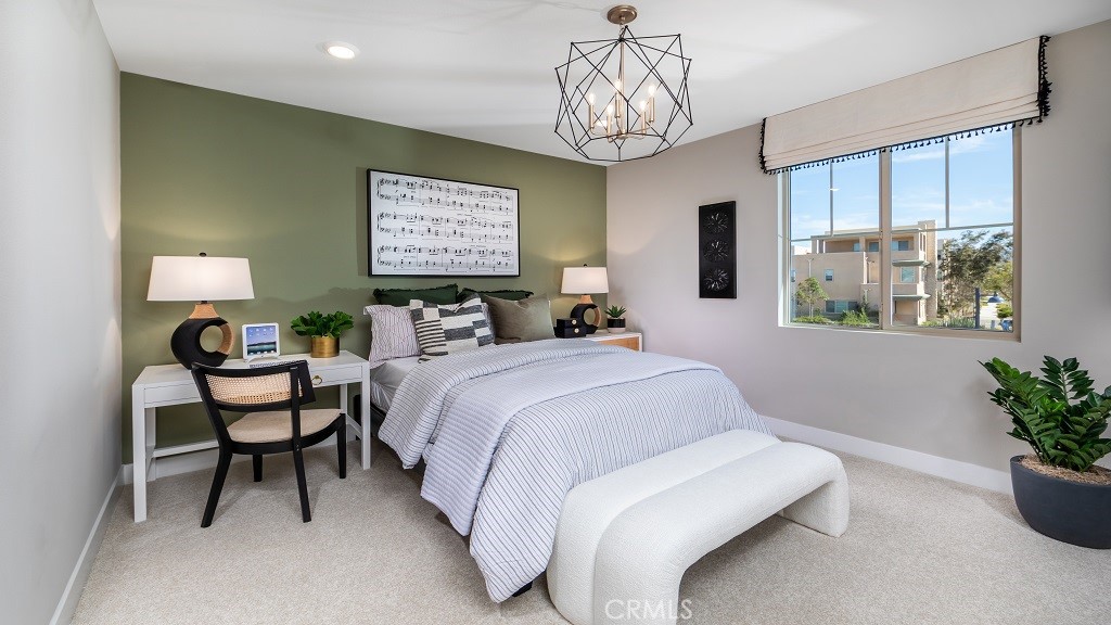 91 Interval Irvine, CA 92618 - Photo 11 of 14 a bedroom with a bed and a chandelier