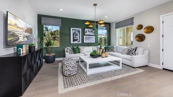 an open kitchen with granite countertop a stove a sink a dining table and chairs