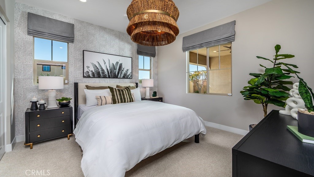 91 Interval Irvine, CA 92618 - Photo 8 of 14 a bedroom with a bed and a potted plant