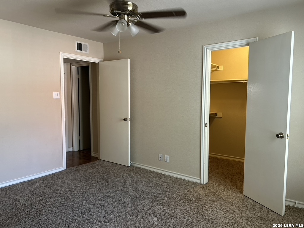 13018 Heimer Road, Unit 710 San Antonio, TX 78216 - Photo 14 of 27 an empty room with windows and closet