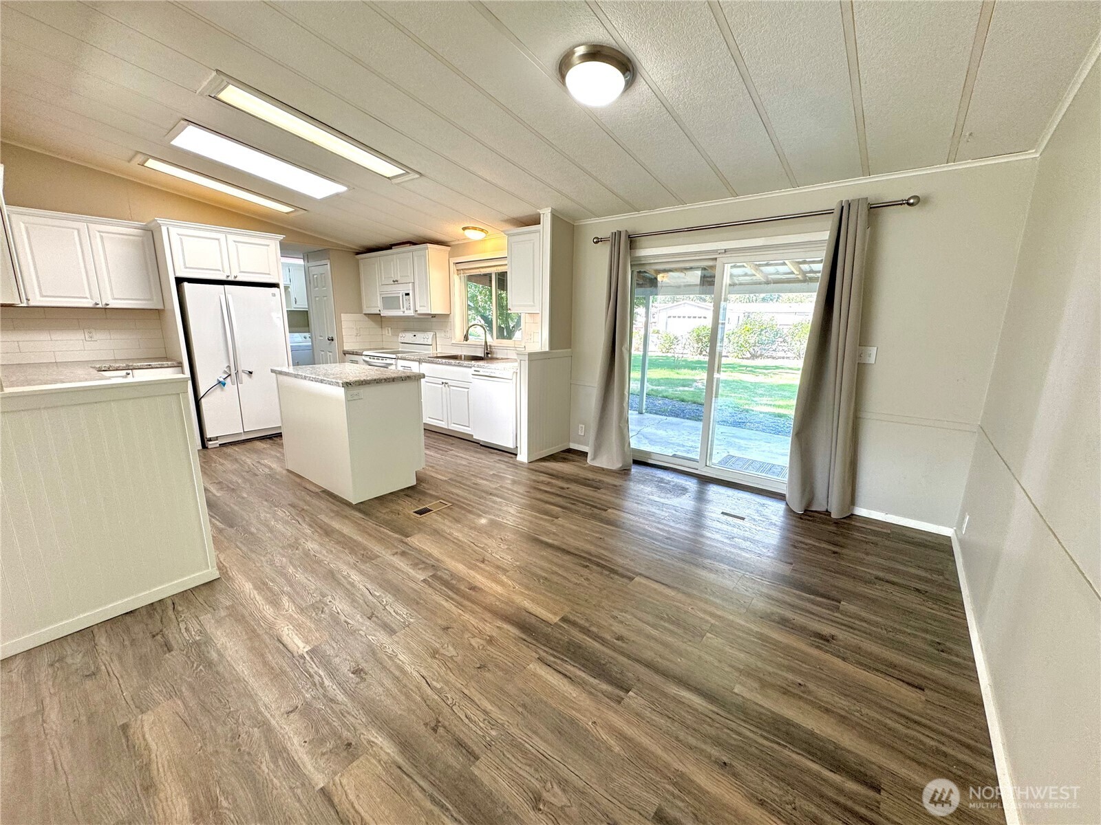 1218 South 3rd Street Dayton, WA 99328 - Photo 9 of 23 a view of a room with wooden floor and a window
