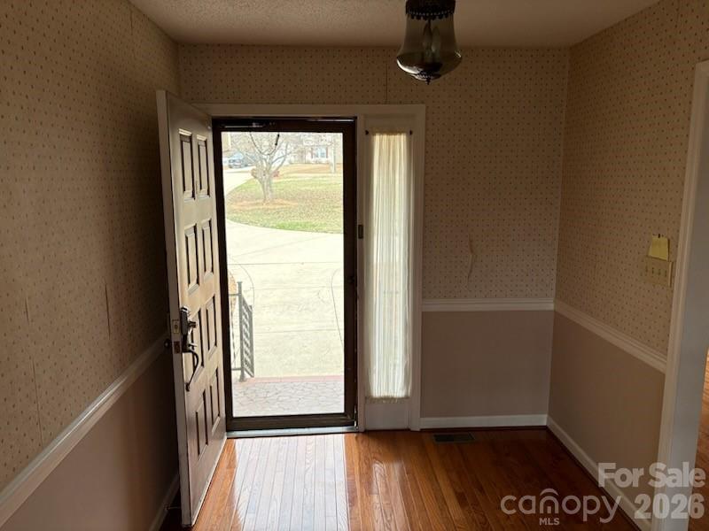 2610 Taylor Road Shelby, NC 28152 - Photo 15 of 47 an empty room with wooden floor and windows