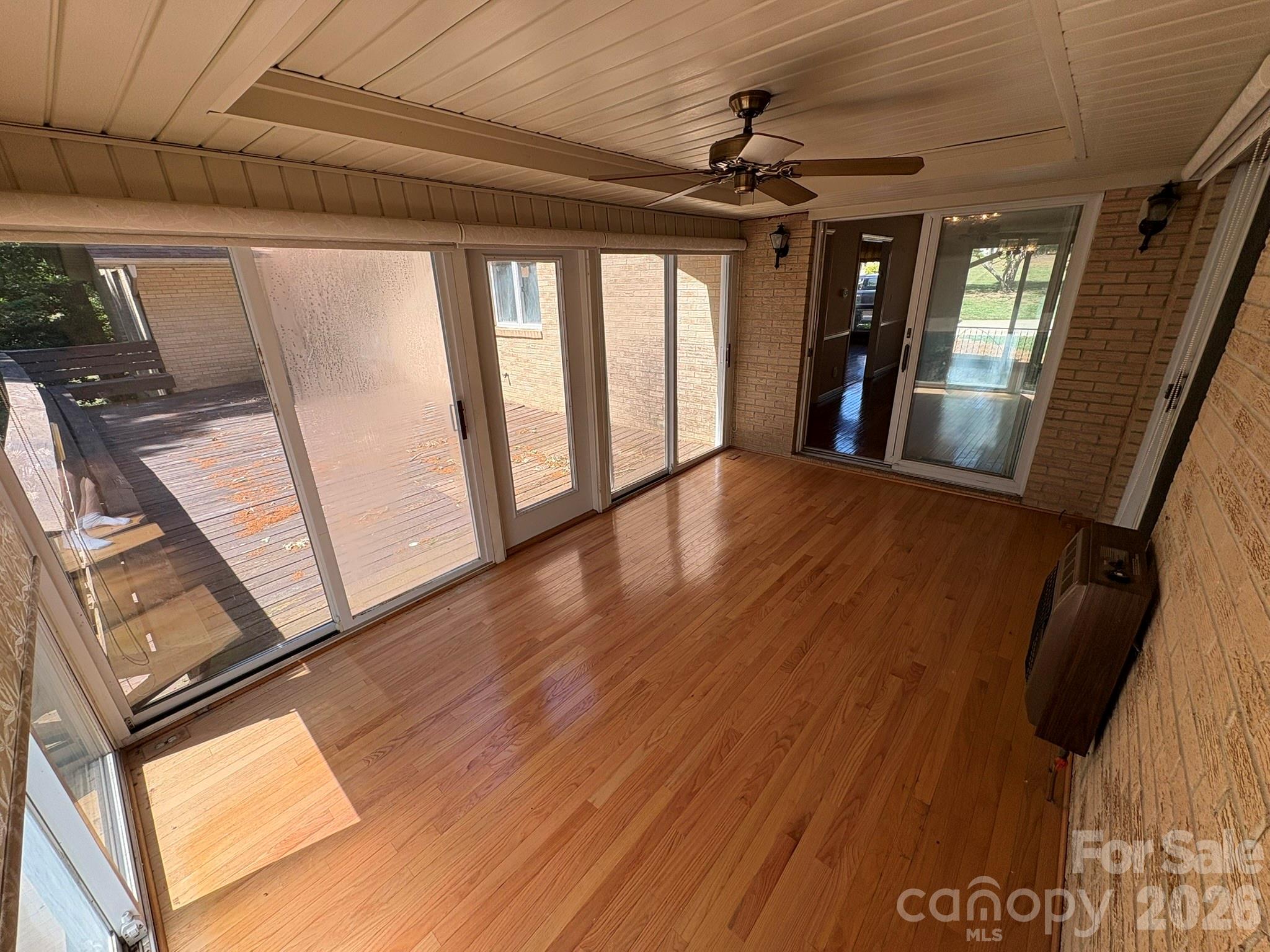 2610 Taylor Road Shelby, NC 28152 - Photo 21 of 47 a view of a hallway with wooden floor and stairs