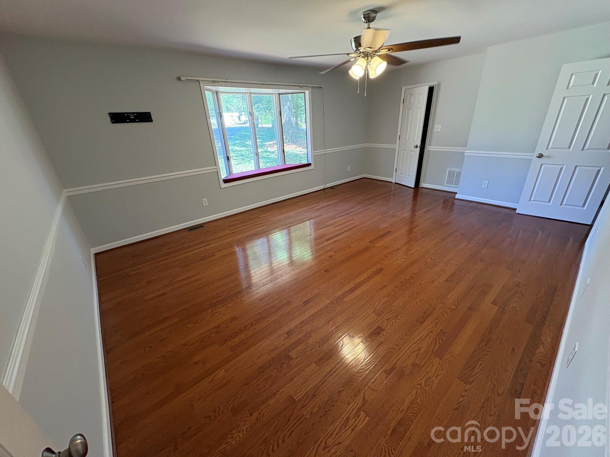 2610 Taylor Road Shelby, NC 28152 - Photo 24 of 47 a view of an empty room with wooden floor and a window