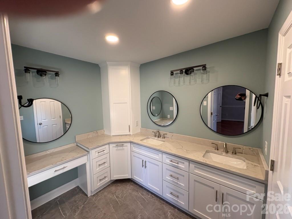 2610 Taylor Road Shelby, NC 28152 - Photo 26 of 47 a bathroom with a double vanity sink and a mirror