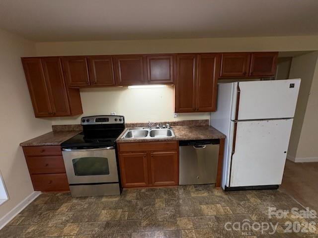 2610 Taylor Road Shelby, NC 28152 - Photo 34 of 47 a kitchen with stainless steel appliances a stove a refrigerator and a cabinets