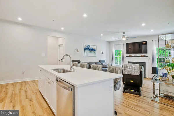 a view of living room with a sink and a fireplace