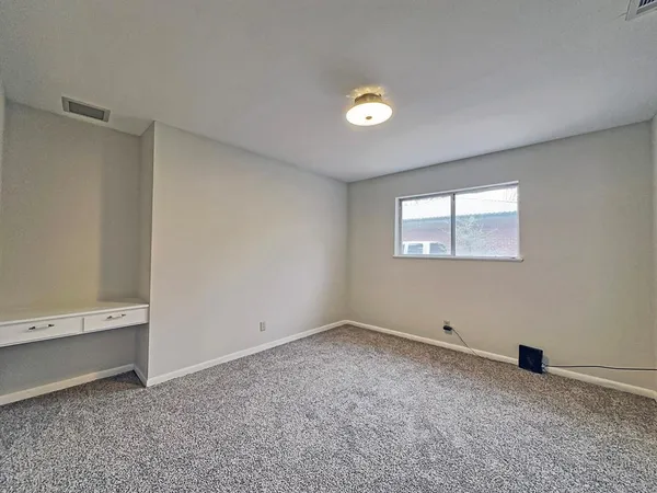 an empty room with a workbench