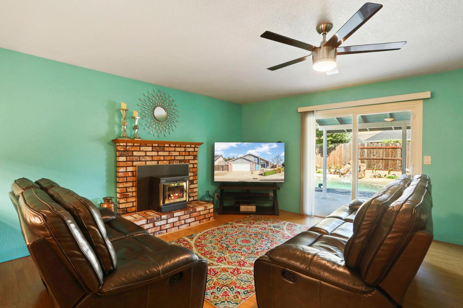 1601 Stanley Drive Ripon, CA 95366 - Photo 18 of 41 a living room with furniture a window and a flat screen tv