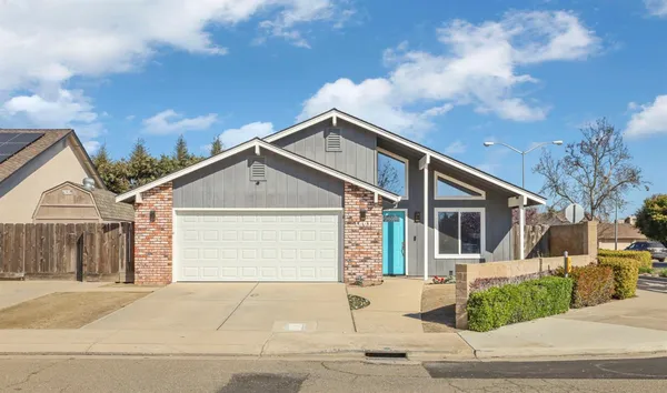 a front view of a house with a garage
