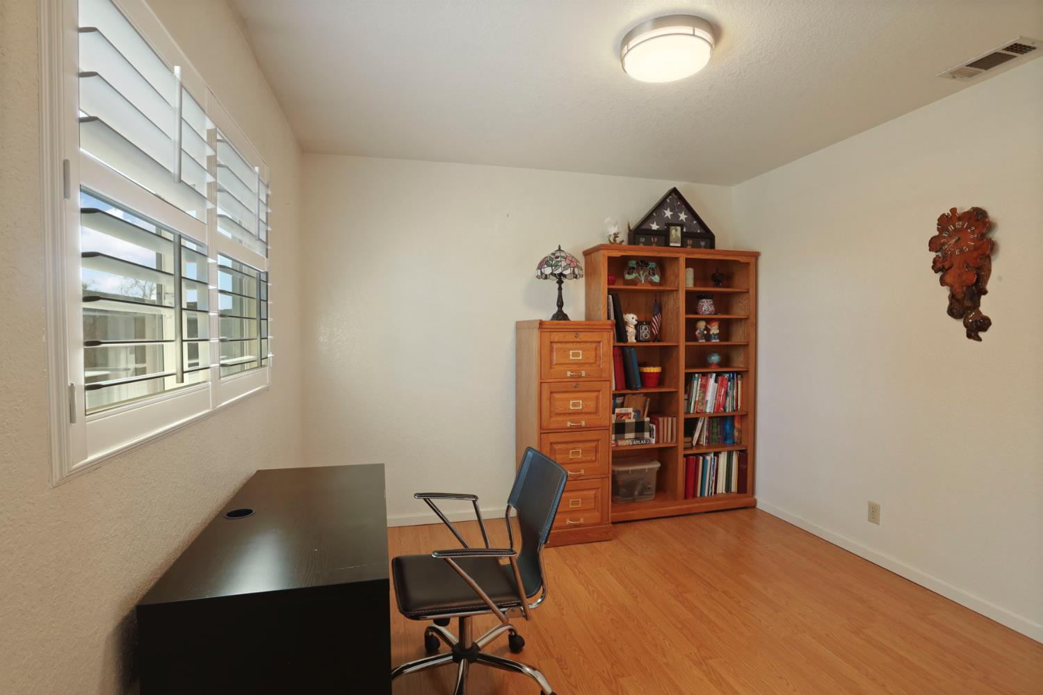 1601 Stanley Drive Ripon, CA 95366 - Photo 24 of 41 a view of a workspace with furniture and a window