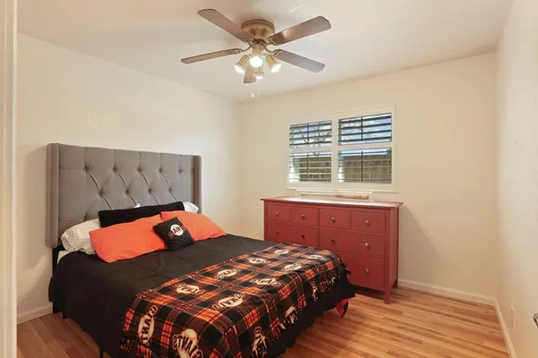 a bedroom with a bed and window