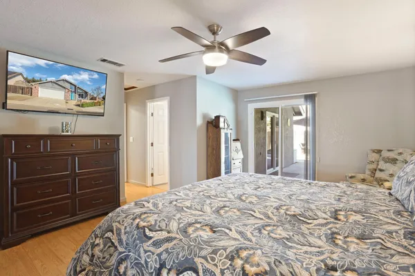 a bedroom with a bed and a dresser