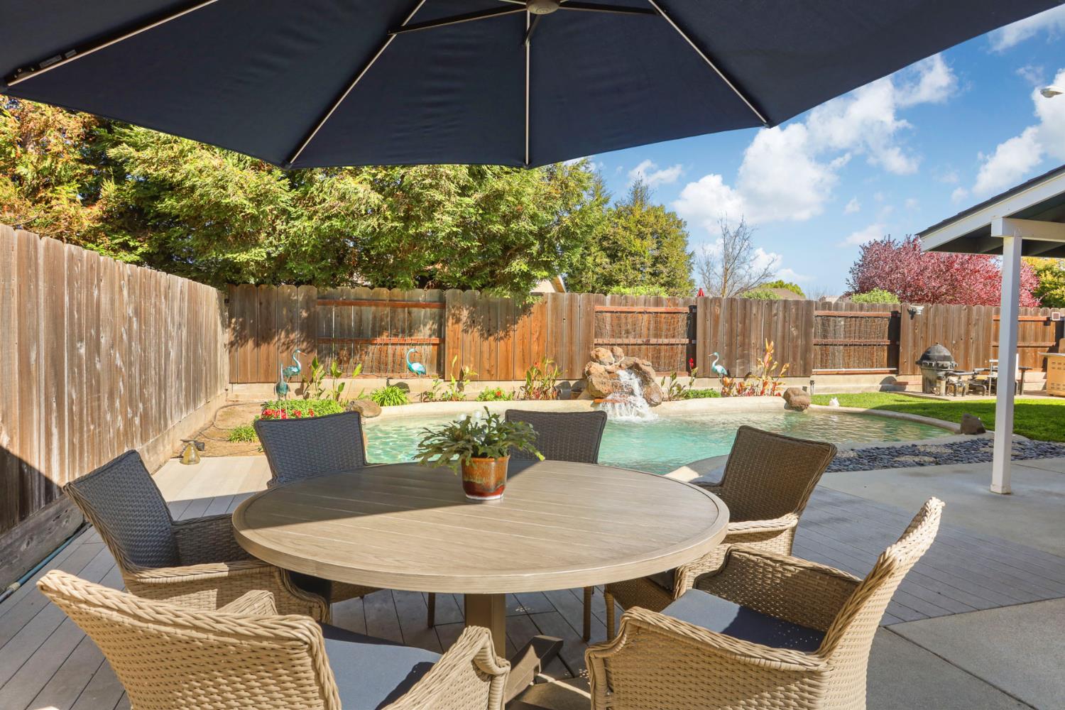 1601 Stanley Drive Ripon, CA 95366 - Photo 35 of 41 a patio with table and chairs
