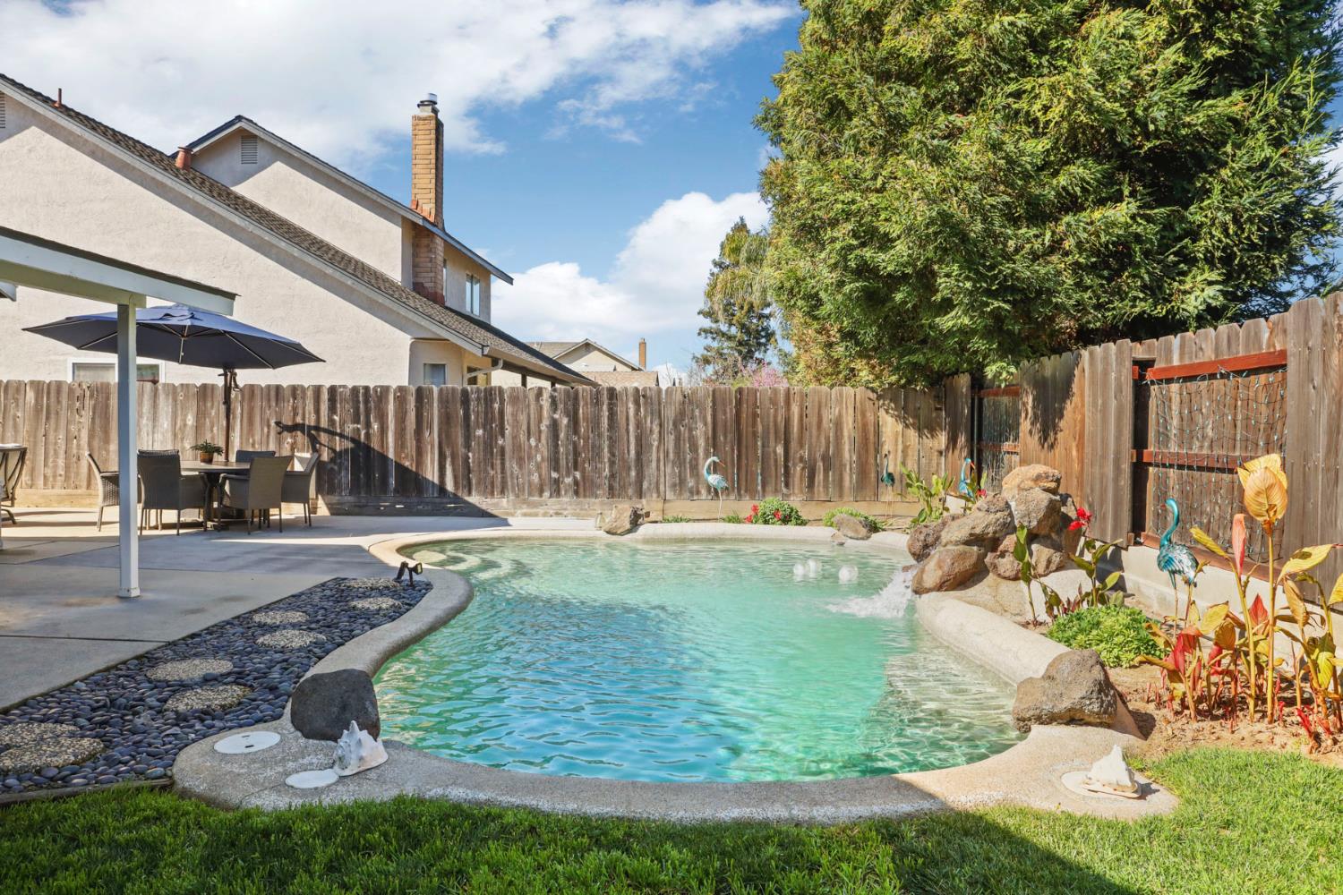 1601 Stanley Drive Ripon, CA 95366 - Photo 39 of 41 a view of a backyard with swimming pool