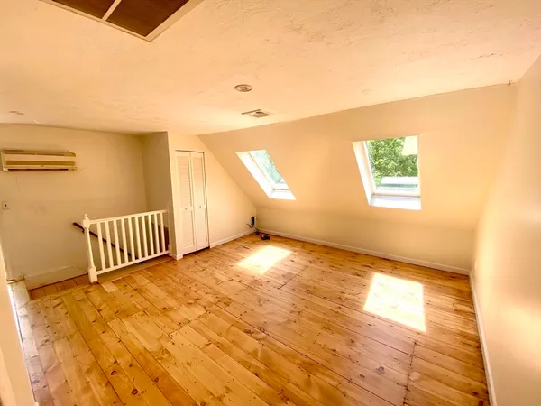 a view of an empty room and a window