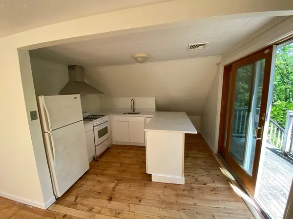 a view of a hallway with washer and dryer