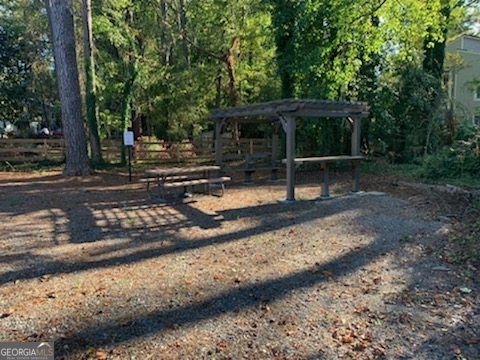 200 Willow Road, Unit 2B Peachtree City, GA 30269 - Photo 8 of 14 a view of a bench sitting in the middle of a yard