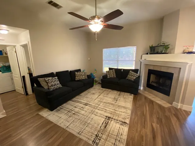 a living room with furniture and a fireplace